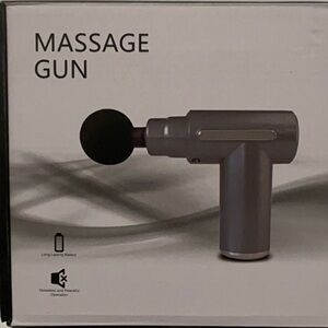 Gray Massage Gun with Four Interchangeable heads to target specific areas.